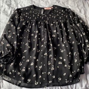 Black blouse with white hearts
